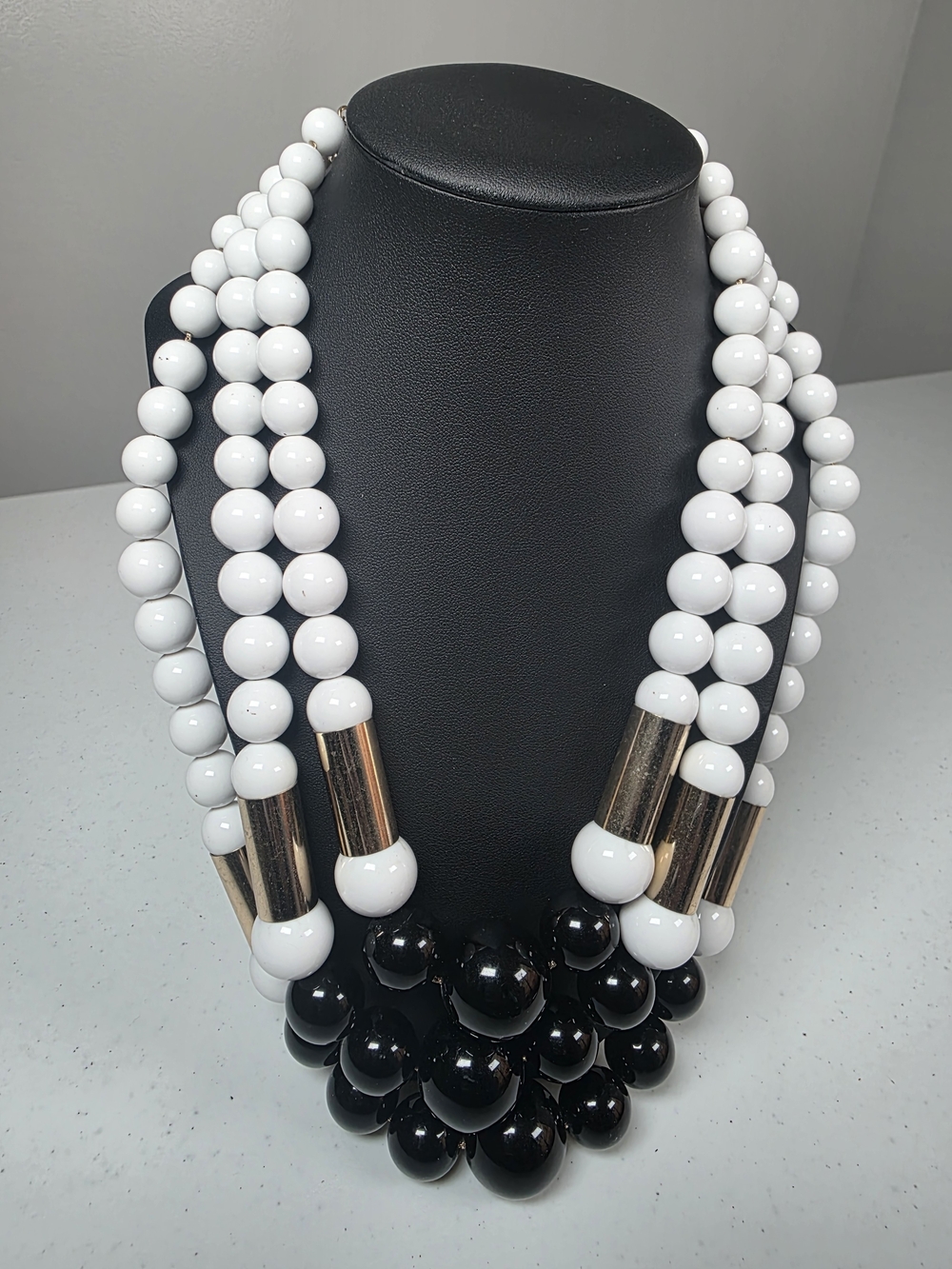 Multi-Strand Black and White Beaded Necklace with Gold Tubes